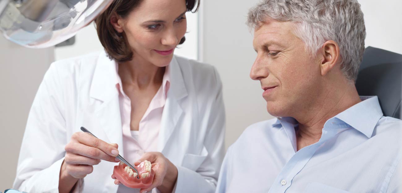 Dental Implants or Dentures: The Better Option | Tioga Dental ...